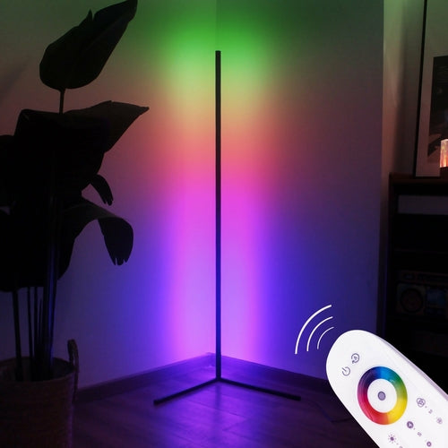 Colorful LED floor lamp with remote control in a room setting