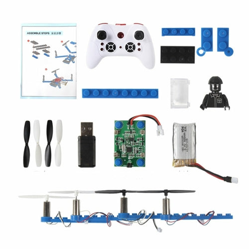 Collection of electronic components and tools for building a model on a white background
