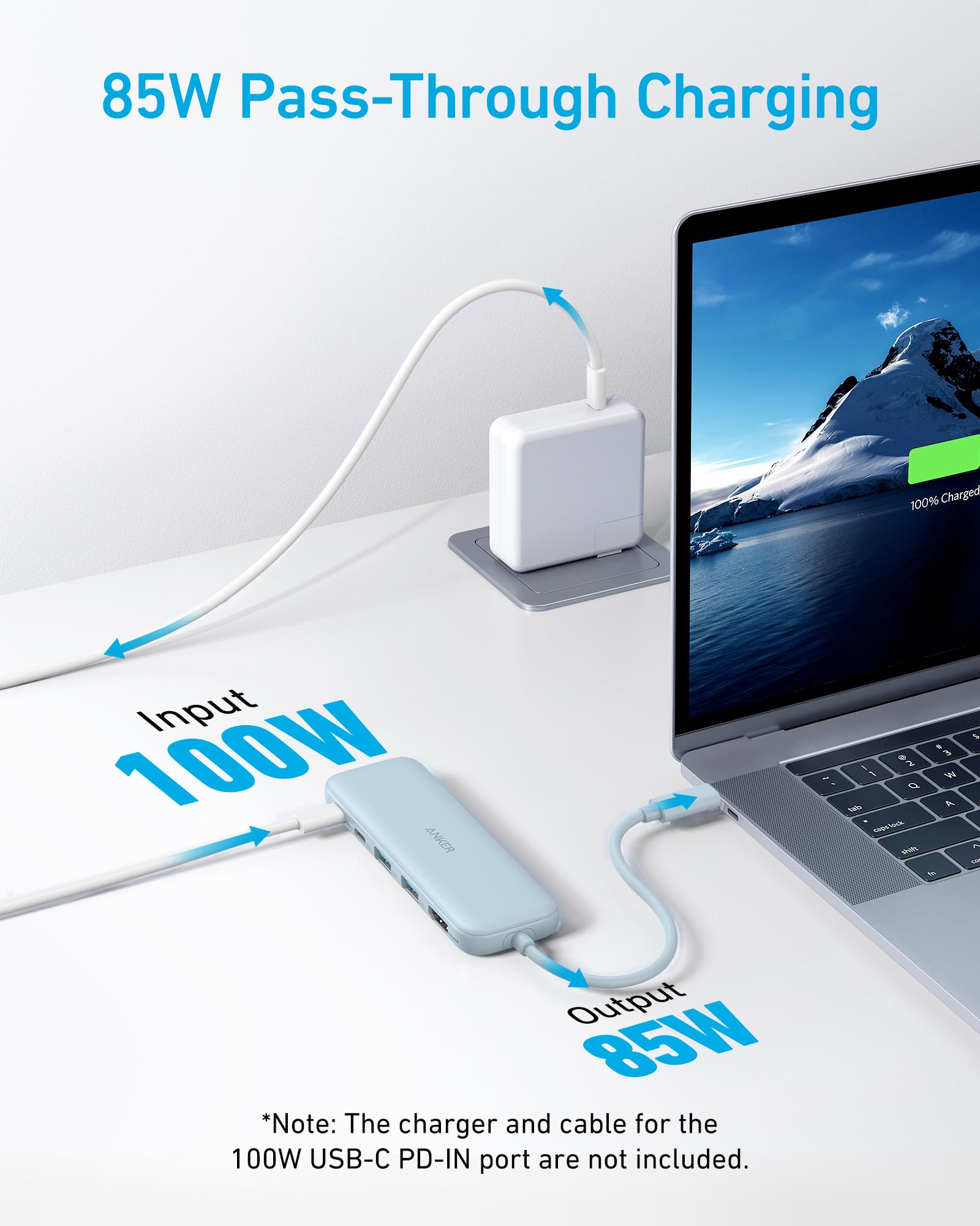 85W pass-through charging setup with laptop and power adapter on a white surface.