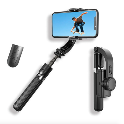 Black selfie stick with remote control on a white background