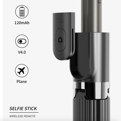 Close-up of a selfie stick with wireless remote and charging details on a white background