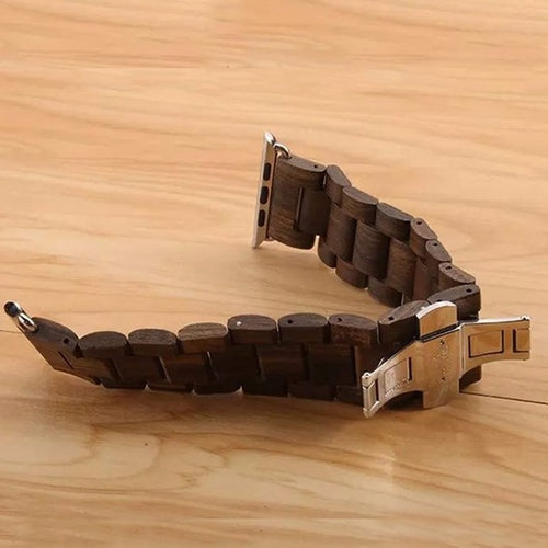 Wooden watch strap on a wooden surface