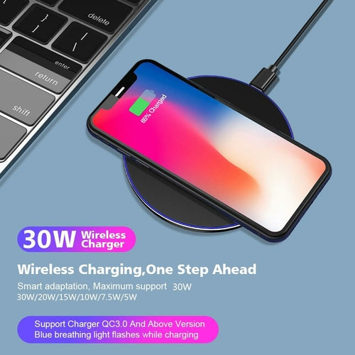 Smartphone on a wireless charger with text highlighting 30W wireless charging capability.