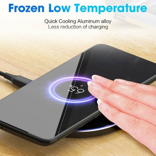 Wireless charging pad with hand touching it on a wooden surface, text about frozen low temperature and quick cooling alloy.